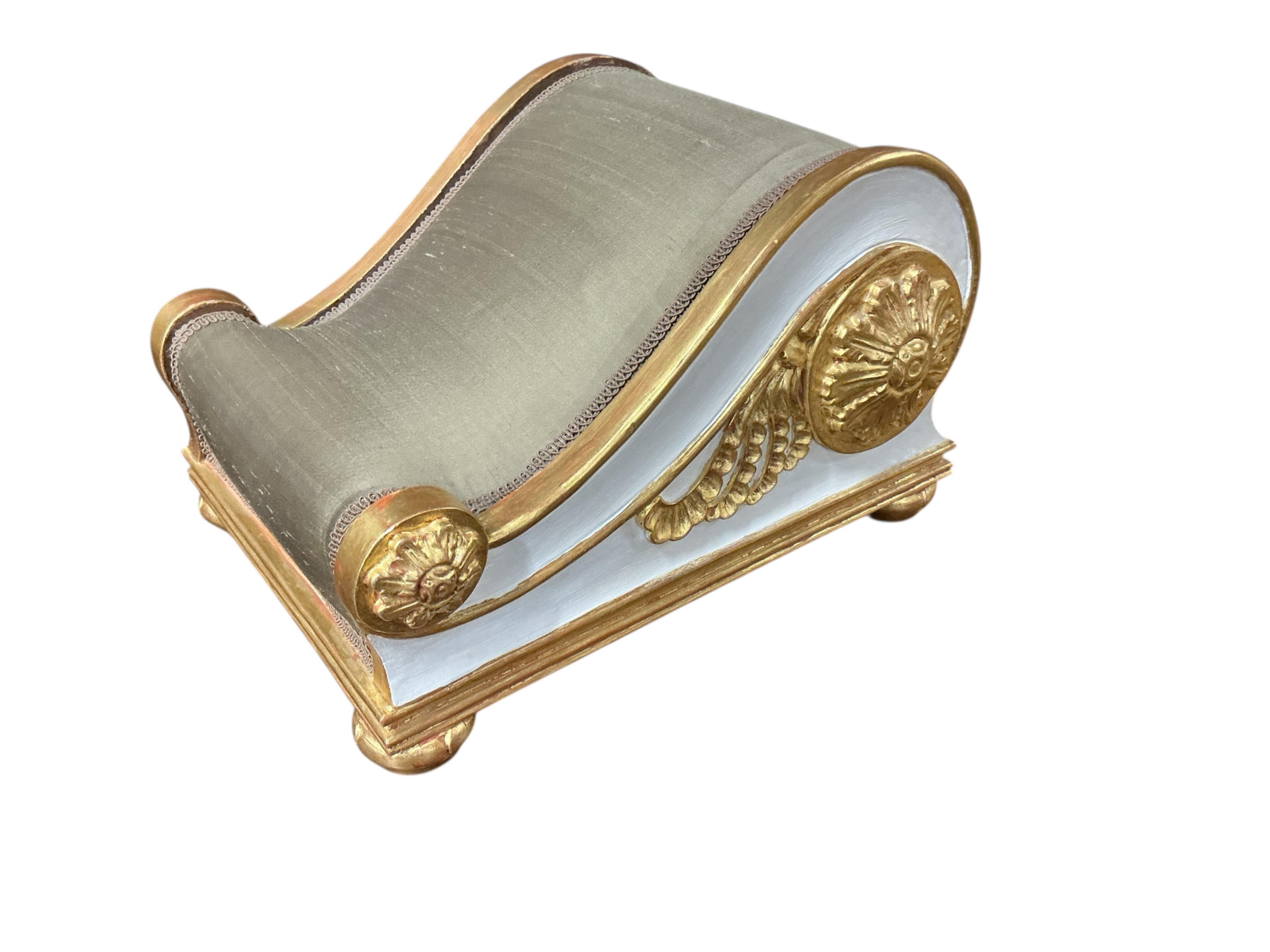 A pair of Regency style painted upholstered footstools, width 28cm, depth 36cm, height 22cm